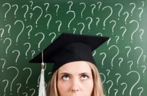 An image of someone in a graduation cap with question marks surrounding her in the background.