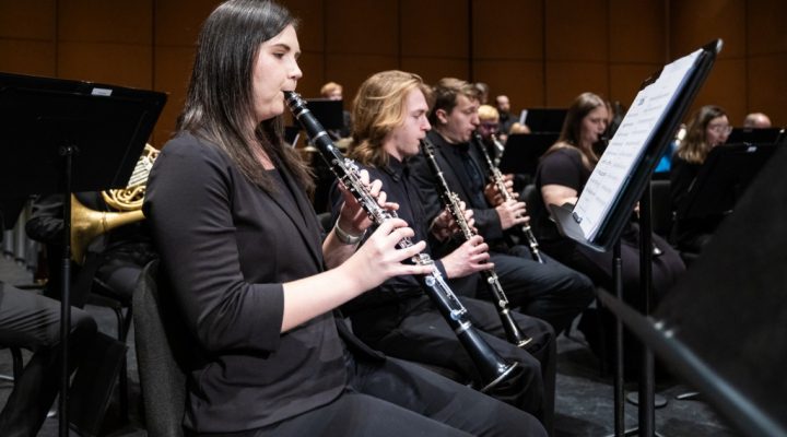 students play clarinets during a wind ensemble rehearsal