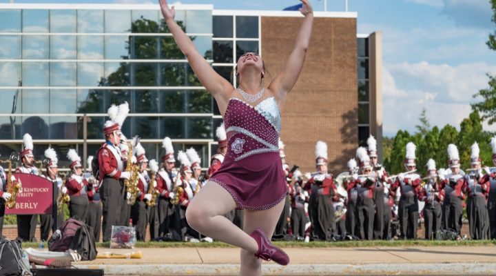 a featured twirler rehearses with the Marching Colonels