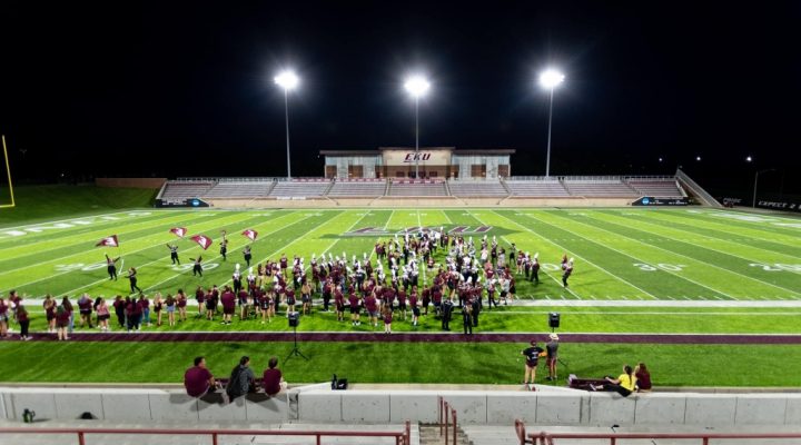 the Marching Colonels rehearse on the football field for Maroon Night