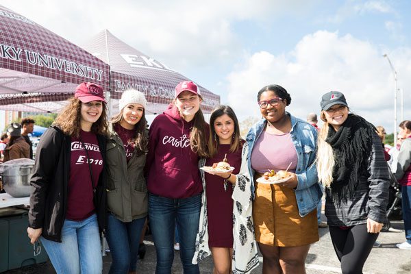 a group of students at a tailgate