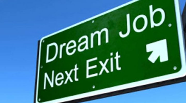 A highway sign with "Dream job next exit" written on it.