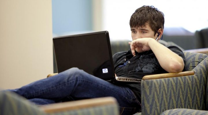 A student studies on campus.