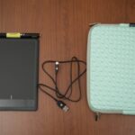A Wacom with charger and case
