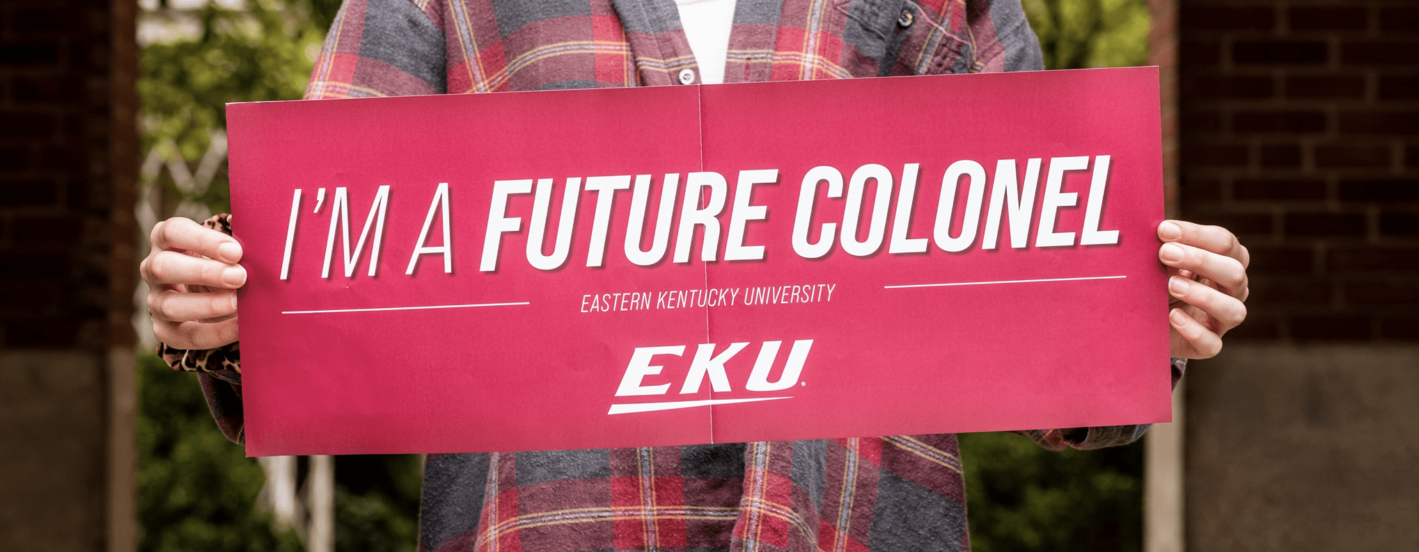 EKU Student Holding a Sign that says I'm a future colonel