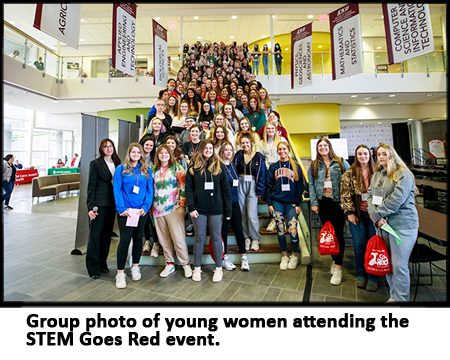 Group photo of the young women attending the STEM Goes Red event