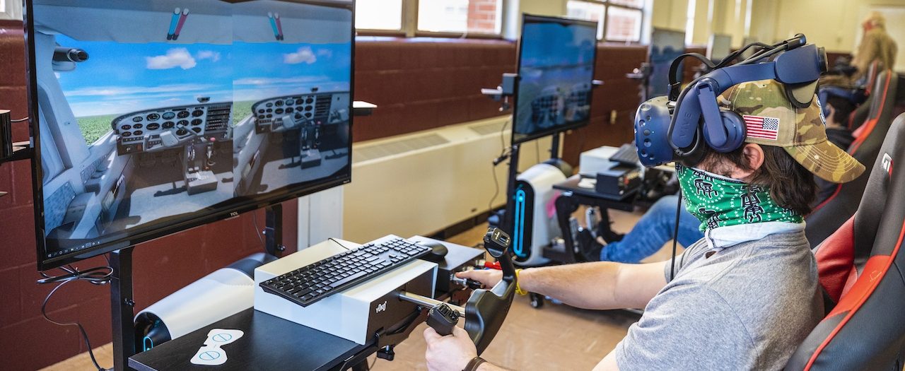 a student uses the new aviation simulator in the EKU Flight Simulator Lab