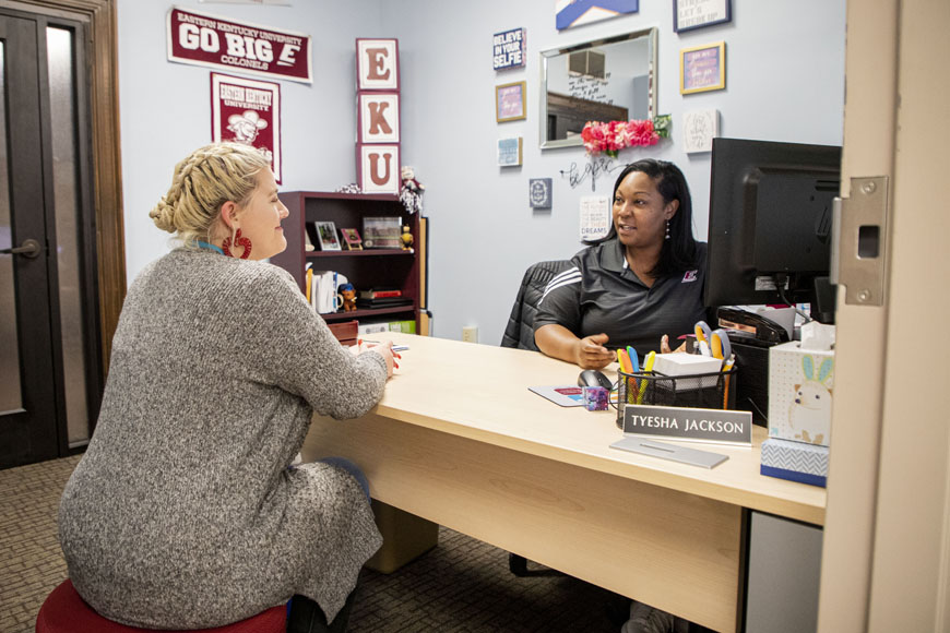 A student visits advisor at the Student Success Center