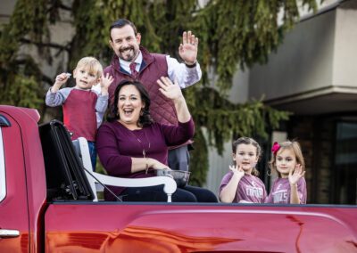 EKU President and family in truck wave during Homecoming parade