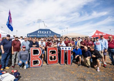 Fraternity pose with Greek letter cutouts at event
