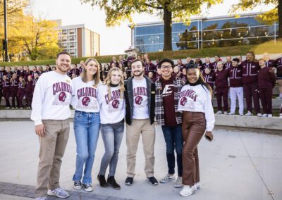 a group of students wearing EKU merch pose together