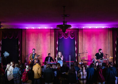 wide angle view of Tenille Arts and band with standing audience