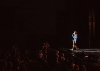 wide angle of Jesse McCartney on stage with dark audience