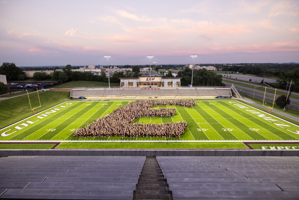 Students form a giant E on the football field