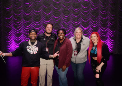 EKU faculty/ staff and Justina Valentine and Conceited from Wild N Out on stage at Eastern Kentucky University.