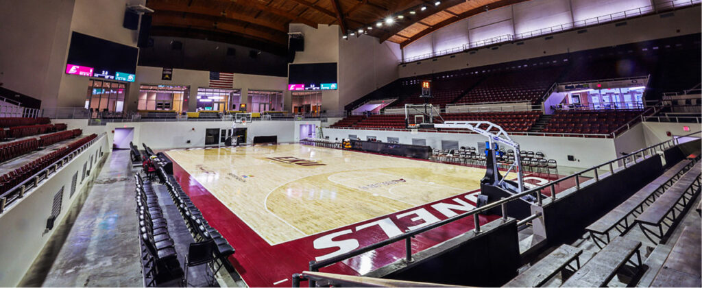 Header image of Alumni Coliseum basketball floor