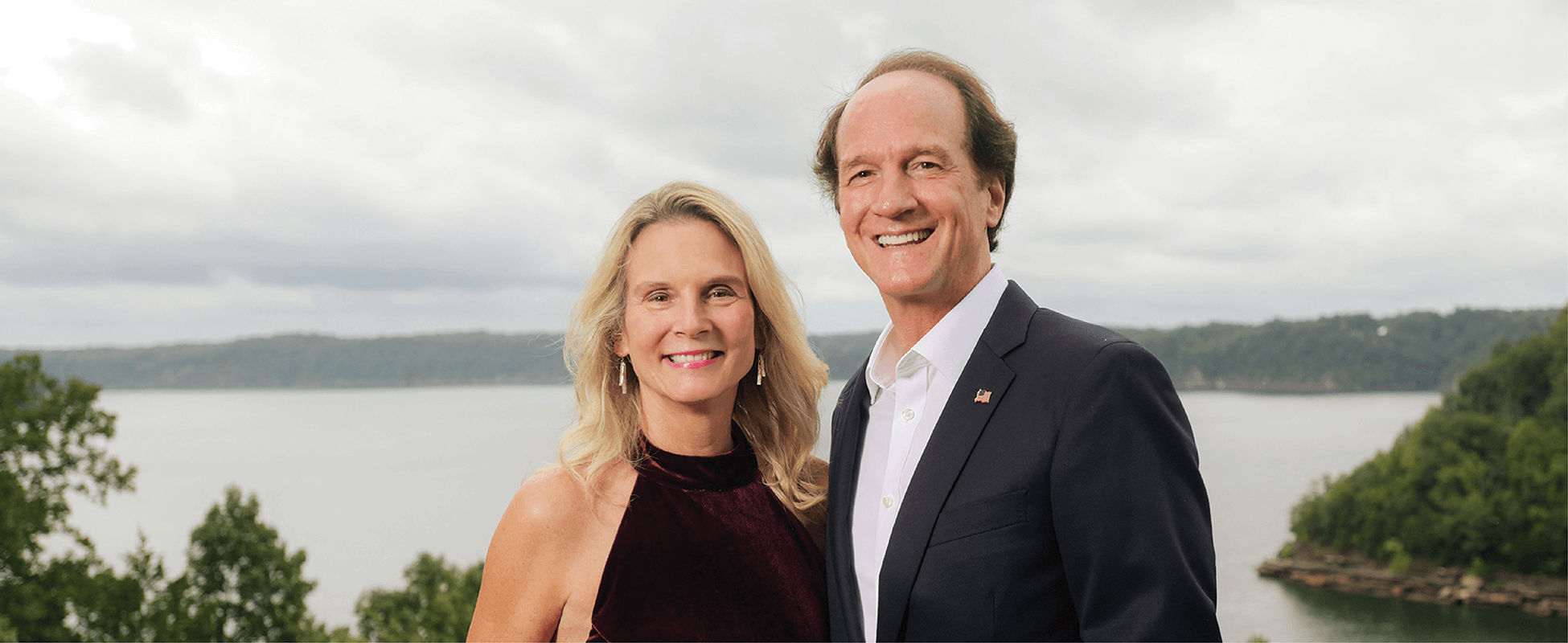 photo of paula and barry ward with a lake in the background