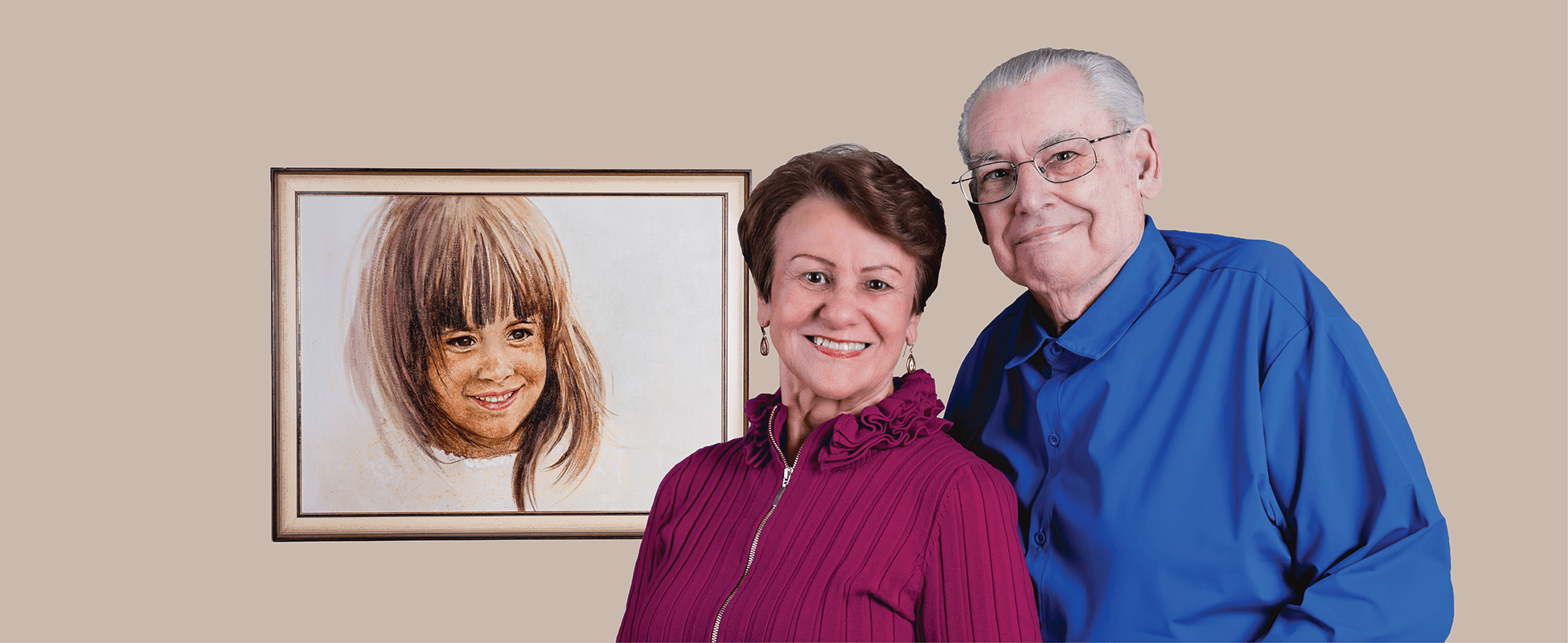 photo of jon and vicki ferrante with drawing of their daughter in the background