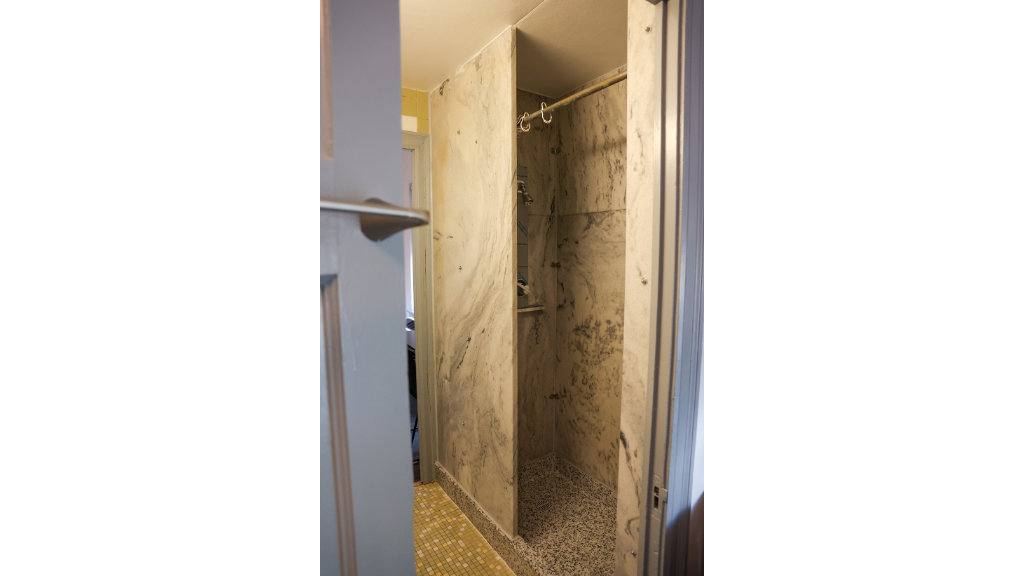 a suite bathroom showing the walk in shower