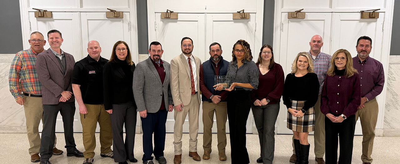 EKU president, David McFaddin, and EKU employees pose for a photo with KEMI representatives on campus.