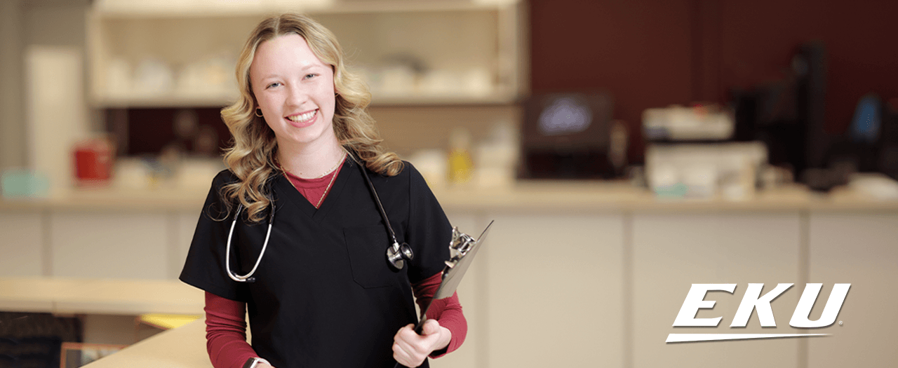 EKU student in scrubs smiling.