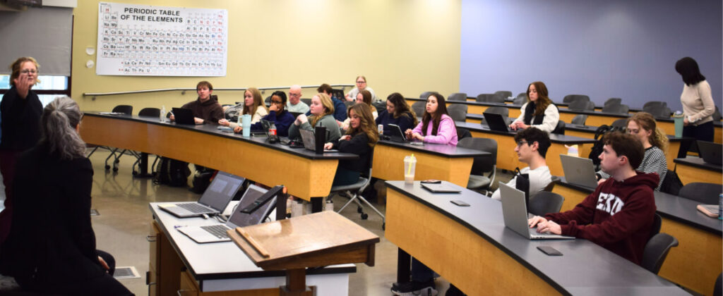 Header image of students sitting in class
