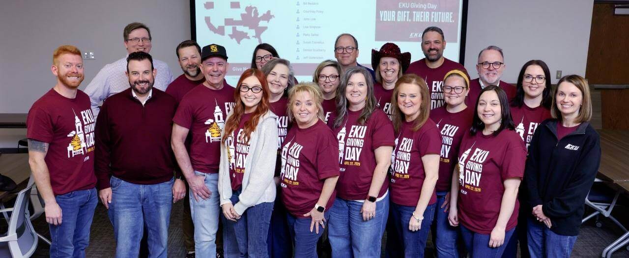 Header image group of EKU employees wearing maroon Giving Day shirts