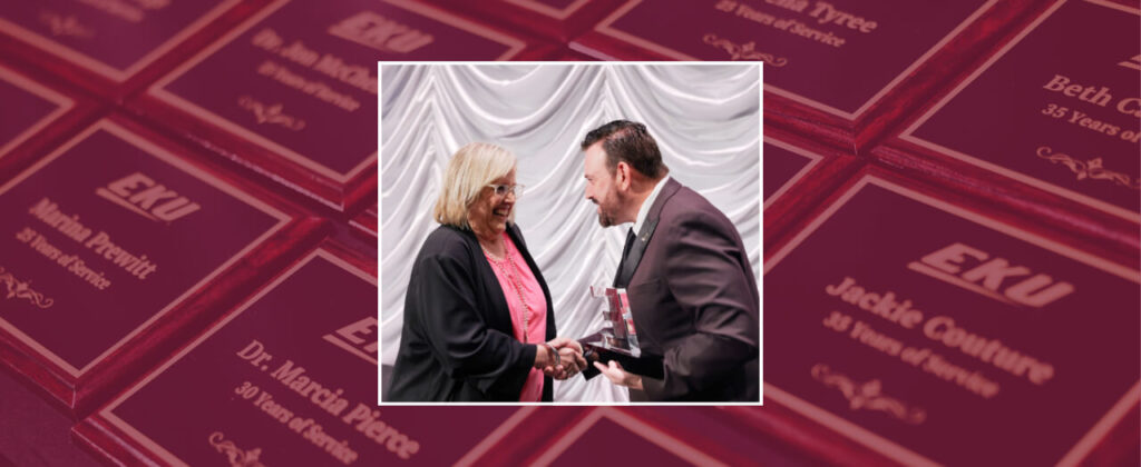 Header image of President David McFaddin presenting an award