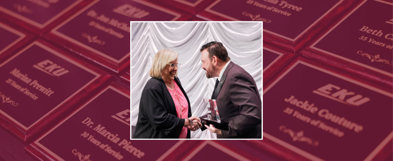 Header image of President David McFaddin presenting an award