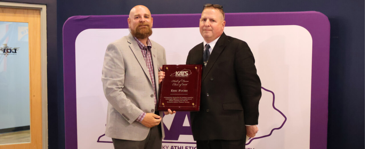 Banner image of Dr. Eric Fuchs receiving his award
