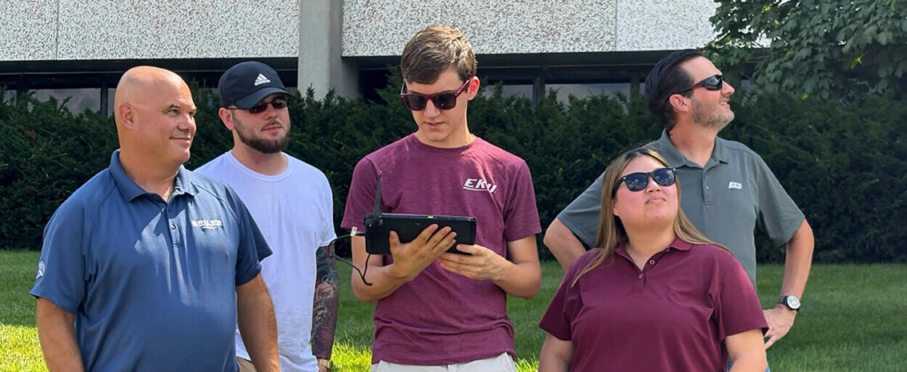 Banner image of Aviation students working with a drone