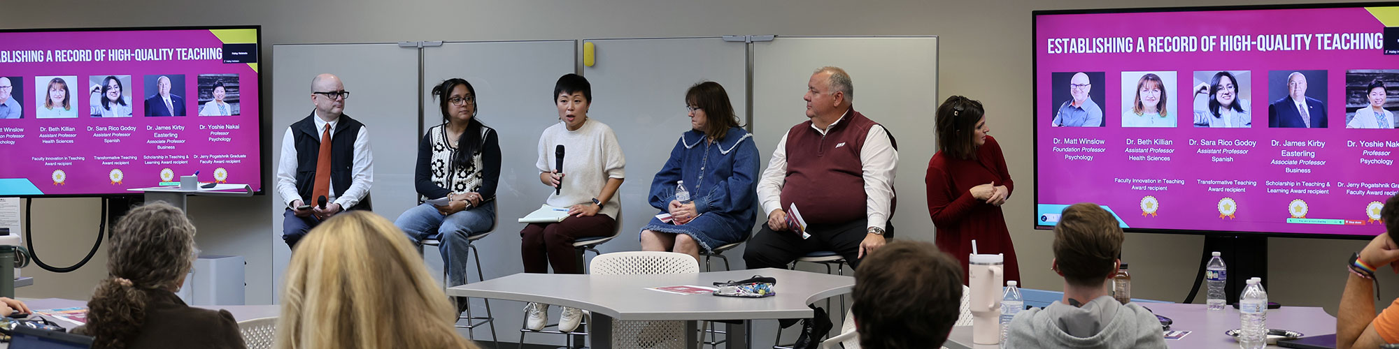 A small group of EKU faculty sit on a panel as speakers to other faculty