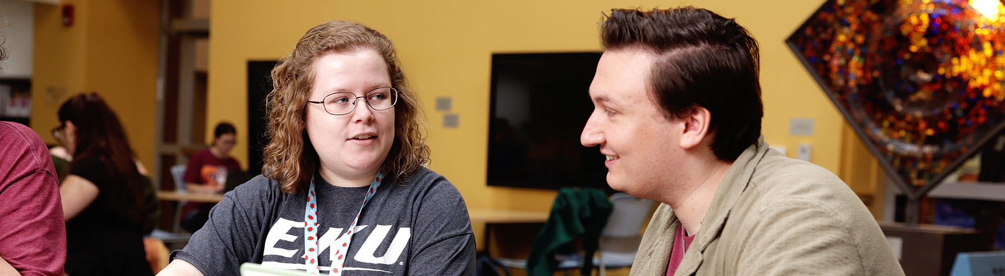 Header image two people talking at Noel Studio