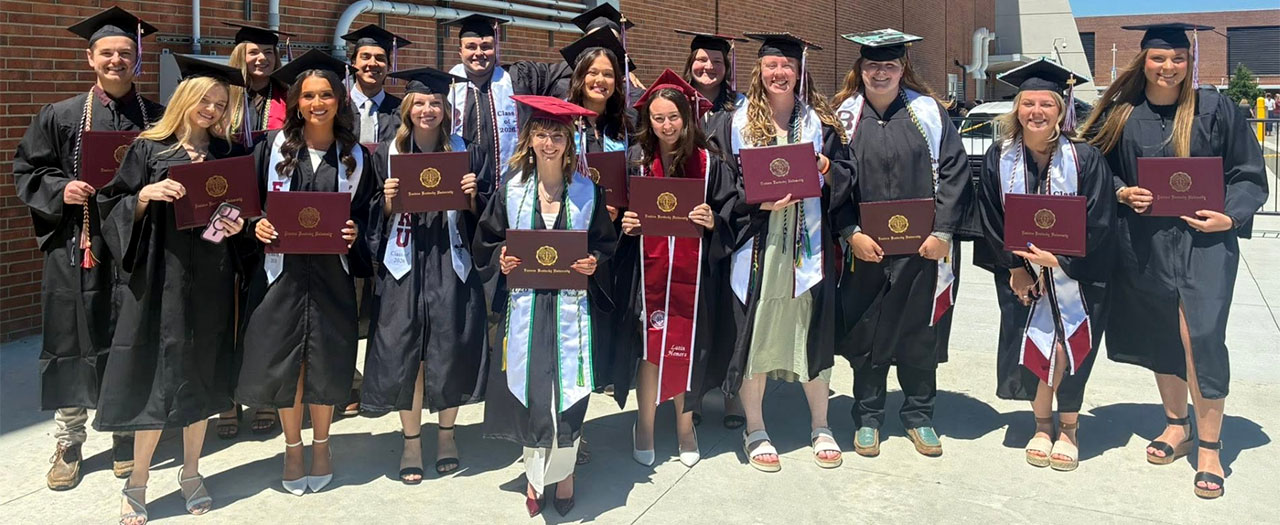 May 2026 graduates pose for a group photo after the commencement ceremony