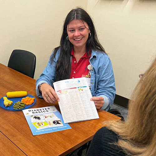 Photo of Jackie Miller RDN with a patient