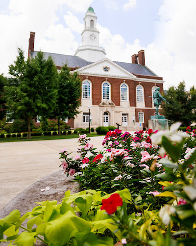 Campus in Spring with flowers in the foreground