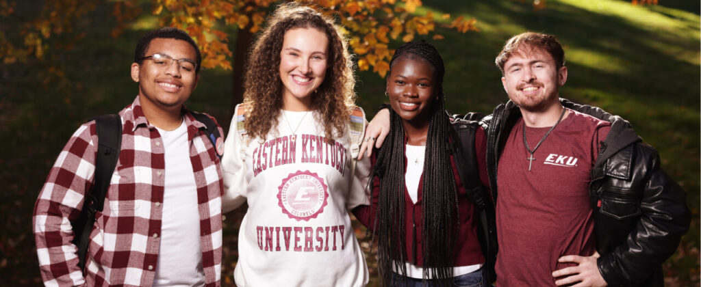 Banner image of a smiling group of EKU students